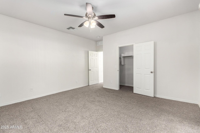 unfurnished bedroom with visible vents, baseboards, and carpet