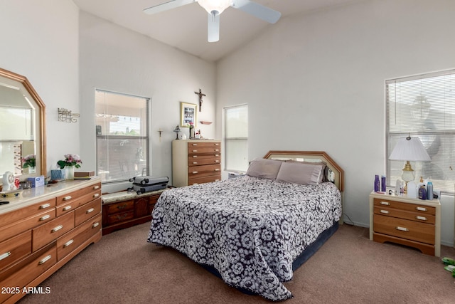 bedroom featuring high vaulted ceiling, ceiling fan, and dark carpet