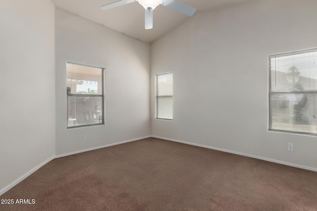 spare room featuring a ceiling fan, high vaulted ceiling, baseboards, and carpet