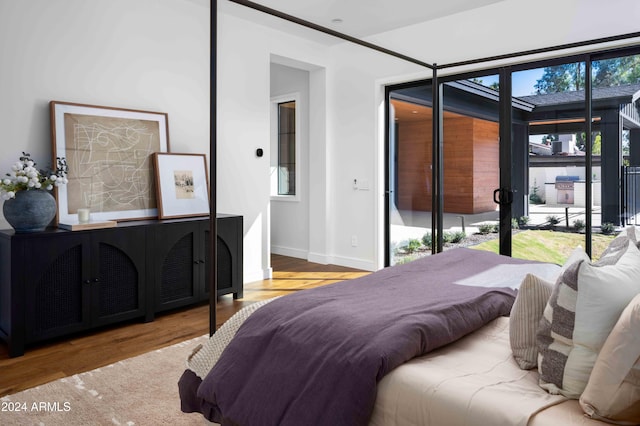 bedroom with light hardwood / wood-style flooring