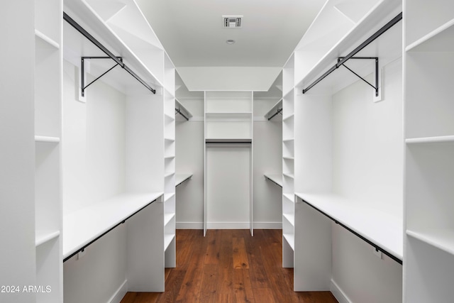 walk in closet featuring dark hardwood / wood-style floors