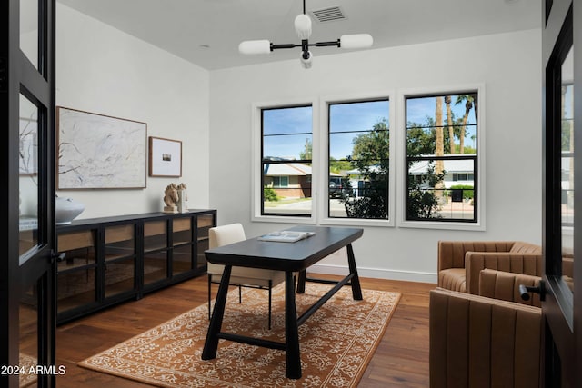 home office featuring dark hardwood / wood-style flooring and a wealth of natural light