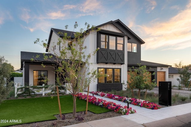 view of front of home with a yard