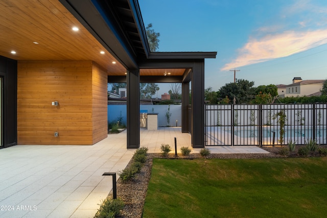 patio terrace at dusk with a lawn