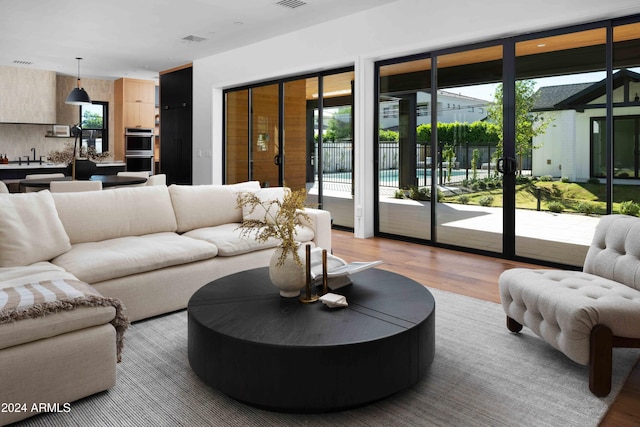 living room with light hardwood / wood-style flooring