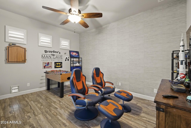 home office with hardwood / wood-style flooring and ceiling fan