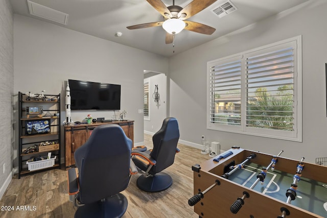 interior space with hardwood / wood-style floors and ceiling fan