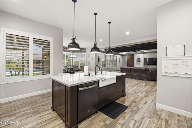 kitchen featuring decorative light fixtures, sink, stainless steel dishwasher, dark brown cabinetry, and light hardwood / wood-style flooring