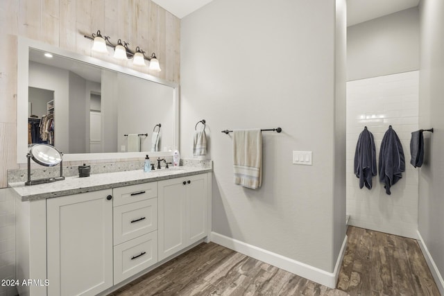 bathroom with hardwood / wood-style flooring and vanity