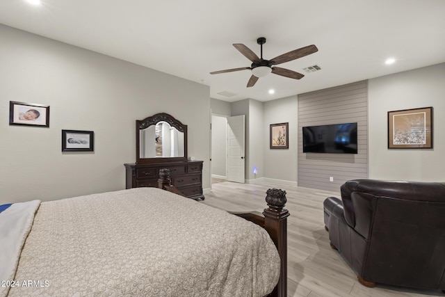 bedroom with light hardwood / wood-style flooring and ceiling fan