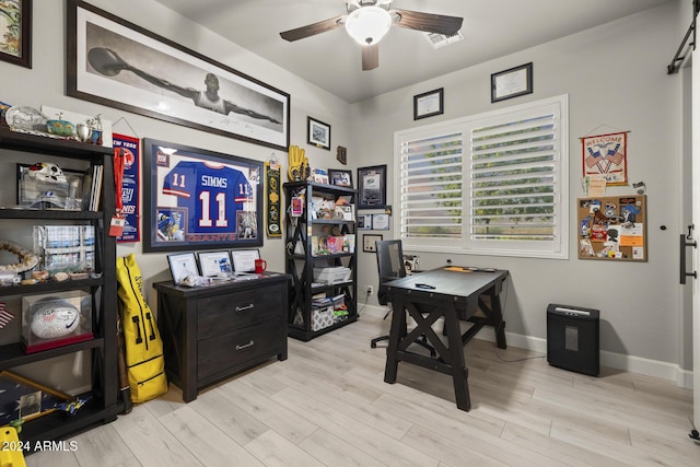 office space with ceiling fan and light wood-type flooring