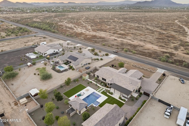 birds eye view of property with a mountain view