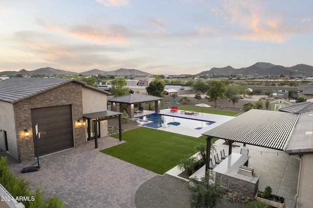 exterior space with a gazebo, a yard, a mountain view, and a patio