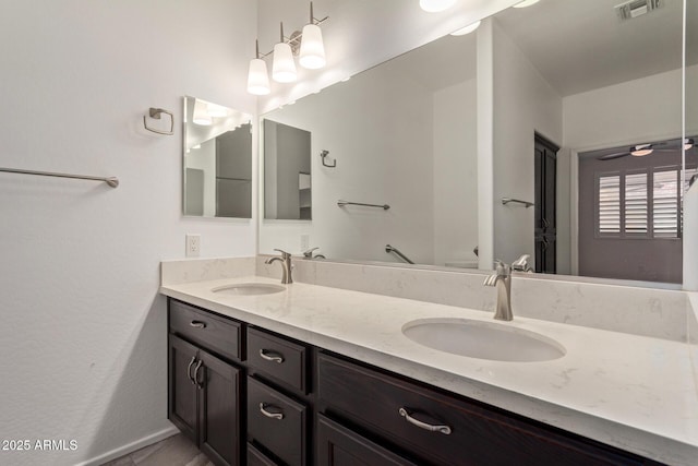 bathroom with vanity and ceiling fan