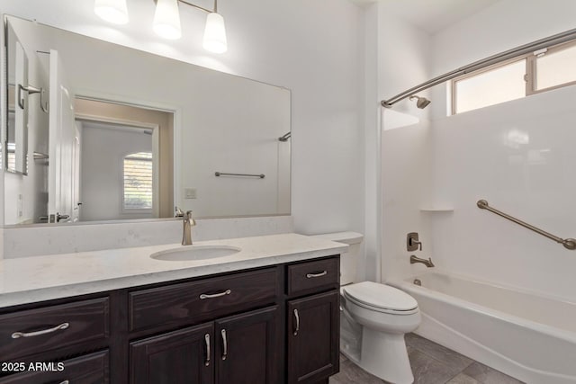 full bathroom featuring bathing tub / shower combination, vanity, and toilet