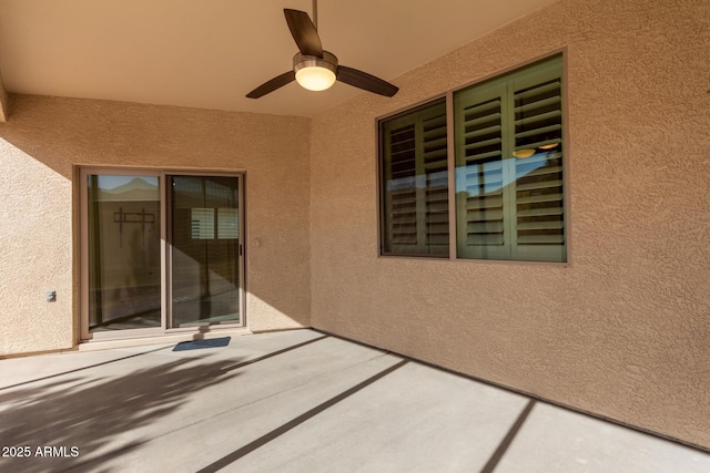 view of patio featuring ceiling fan