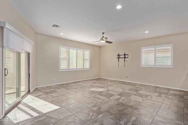 spare room with ceiling fan