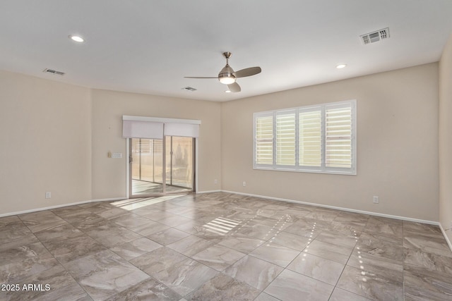 empty room featuring ceiling fan