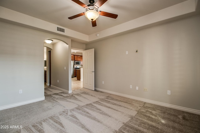 empty room with light carpet and ceiling fan