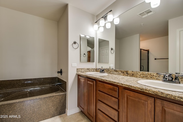 bathroom with tile patterned flooring, vanity, and separate shower and tub