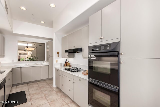 8324 E Cactus Wren Rd, Scottsdale, AZ 85250 - kitchen featuring gas stovetop, under cabinet range hood, light countertops, recessed lighting, and dishwasher
