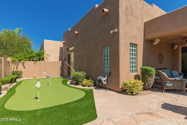 8324 E Cactus Wren Rd, Scottsdale, AZ 85250 - view of yard featuring a putting green and a patio area