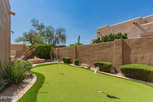 8324 E Cactus Wren Rd, Scottsdale, AZ 85250 - fenced backyard with an area to practice putting and an outdoor fire pit