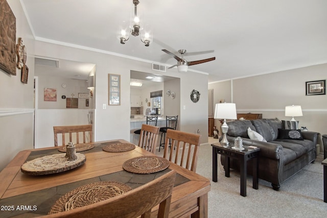 dining room featuring visible vents and ceiling fan with notable chandelier