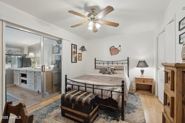 bedroom with light wood-style flooring and ceiling fan