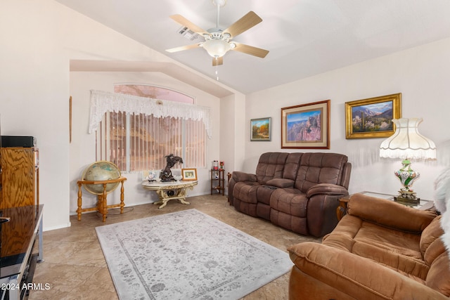 living room featuring ceiling fan and lofted ceiling