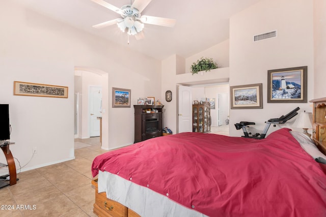 tiled bedroom featuring high vaulted ceiling and ceiling fan