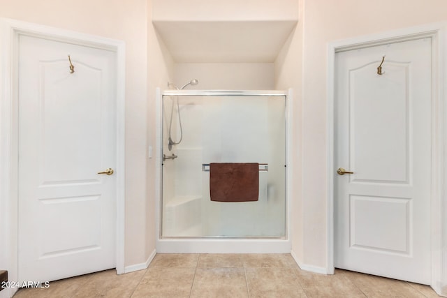 bathroom featuring tile patterned floors and walk in shower