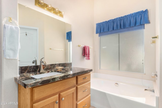 bathroom featuring vanity and a bathtub