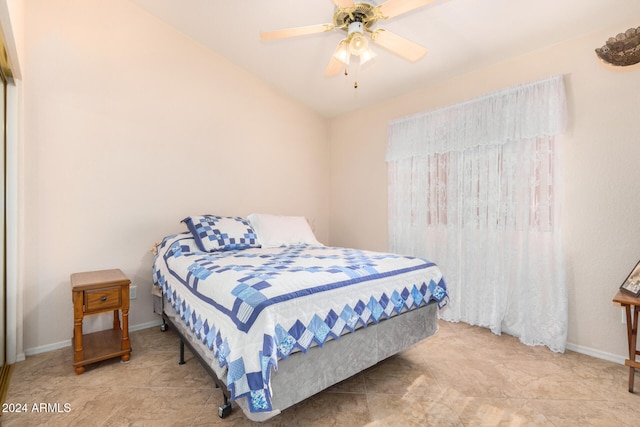 bedroom featuring ceiling fan and vaulted ceiling