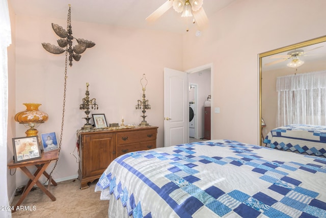 bedroom with ceiling fan, vaulted ceiling, washer / clothes dryer, and a closet