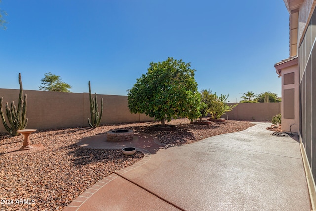 view of patio / terrace featuring an outdoor fire pit