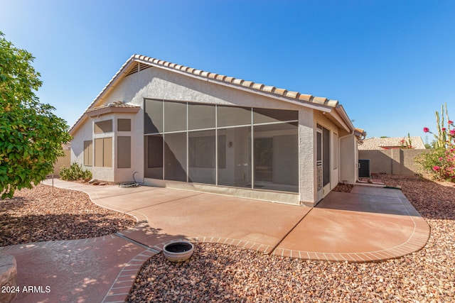 back of property with a patio area