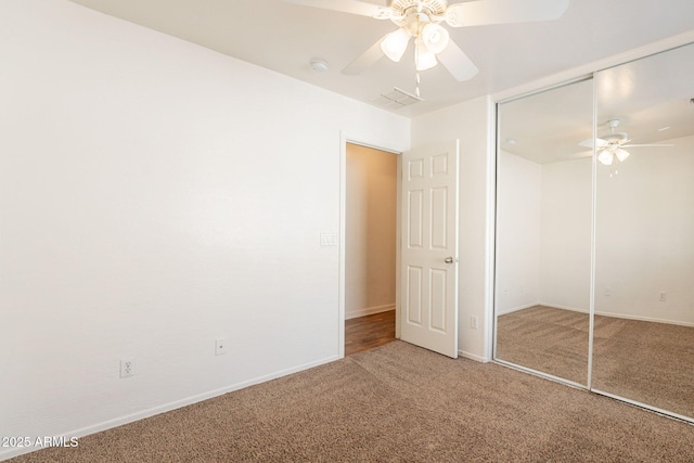 4642 E Sierrita Rd, San Tan Valley, AZ 85143 - unfurnished bedroom featuring carpet flooring, a closet, a ceiling fan, and baseboards