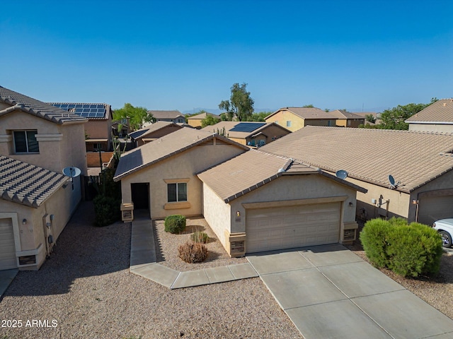 4642 E Sierrita Rd, San Tan Valley, AZ 85143 - view of front of home featuring an attached garage, driveway, stucco siding, and a residential view