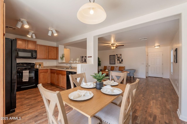 4642 E Sierrita Rd, San Tan Valley, AZ 85143 - dining area with dark wood-style flooring, a ceiling fan, and baseboards