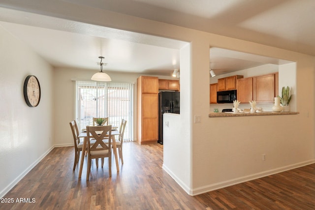 4642 E Sierrita Rd, San Tan Valley, AZ 85143 - dining space featuring dark wood finished floors and baseboards
