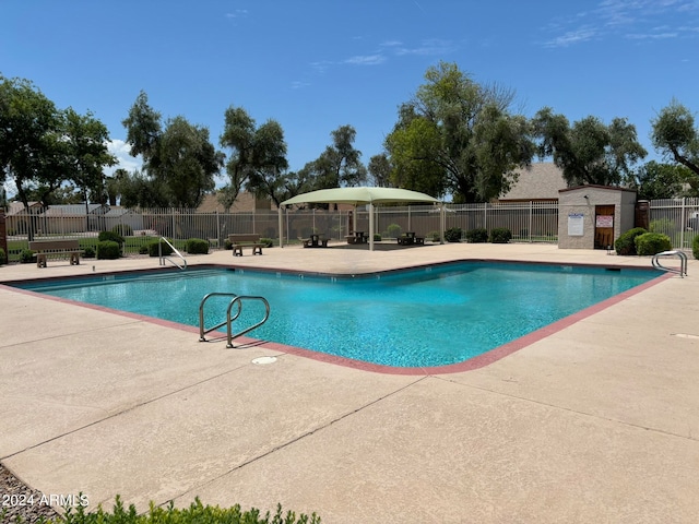 view of swimming pool with a patio area