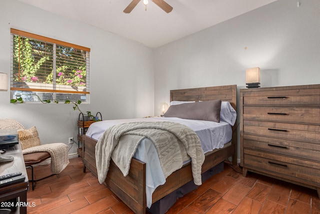 bedroom featuring lofted ceiling, dark wood-type flooring, and ceiling fan