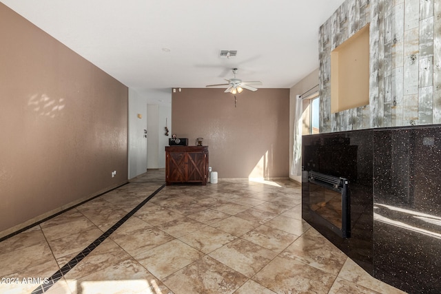 interior space featuring ceiling fan