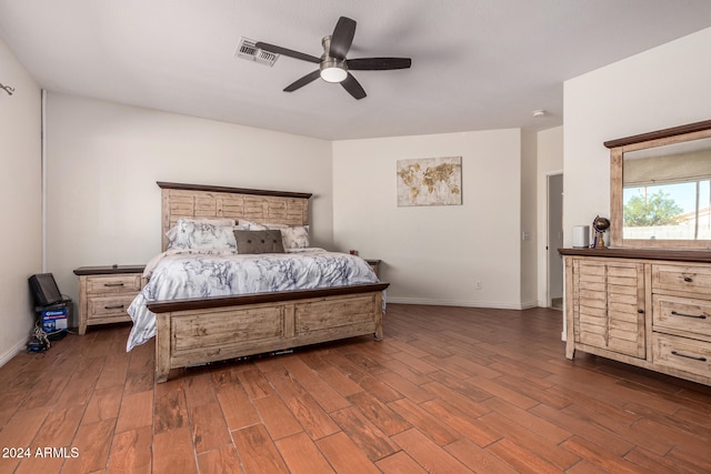 bedroom with dark wood-type flooring and ceiling fan