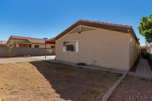 rear view of house featuring a patio area