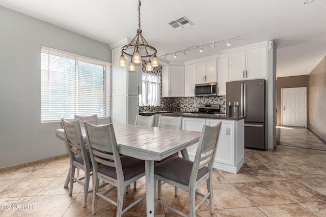 dining room featuring a chandelier