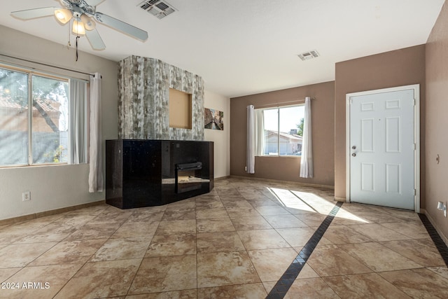 tiled foyer with ceiling fan