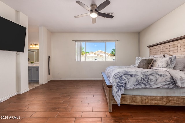 bedroom with connected bathroom, dark wood-type flooring, and ceiling fan