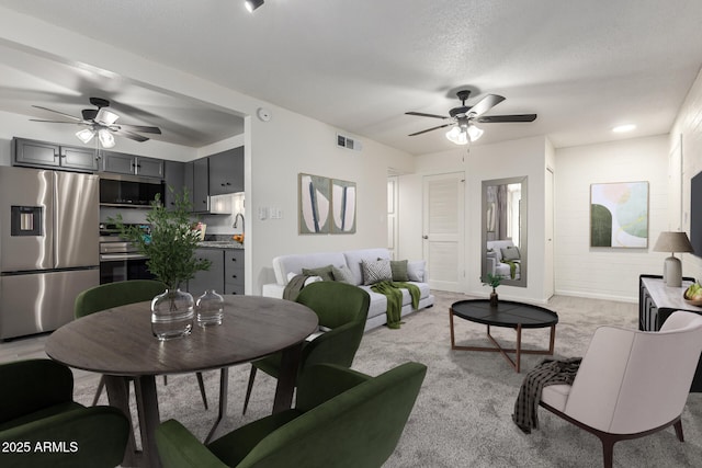 2608 W Berridge Ln Unit 220, Phoenix, AZ 85017 - living room with ceiling fan and light colored carpet